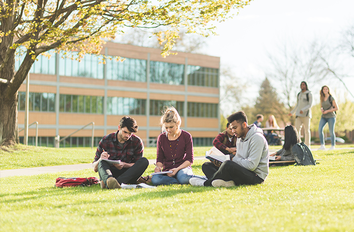 student sitting outside on campus