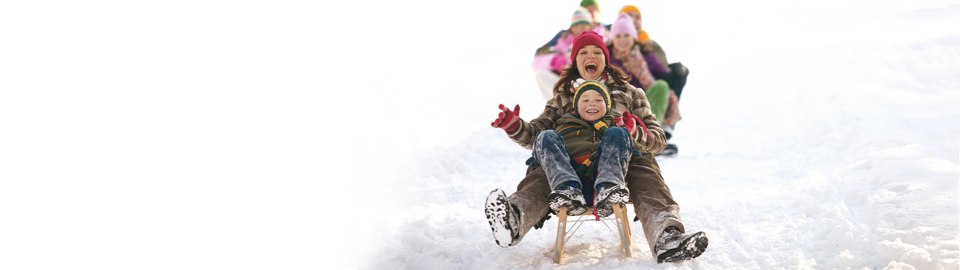Image of family sledding