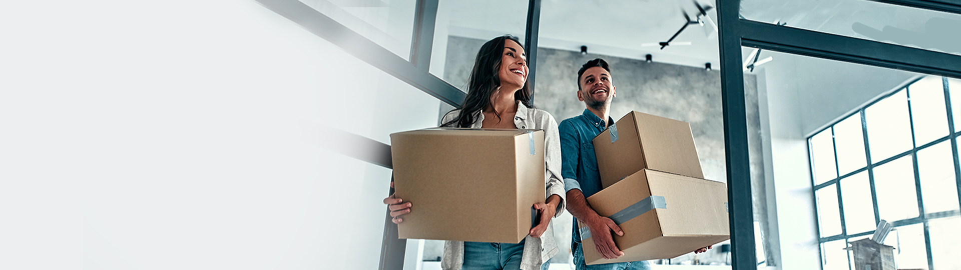 excited couple with moving boxes