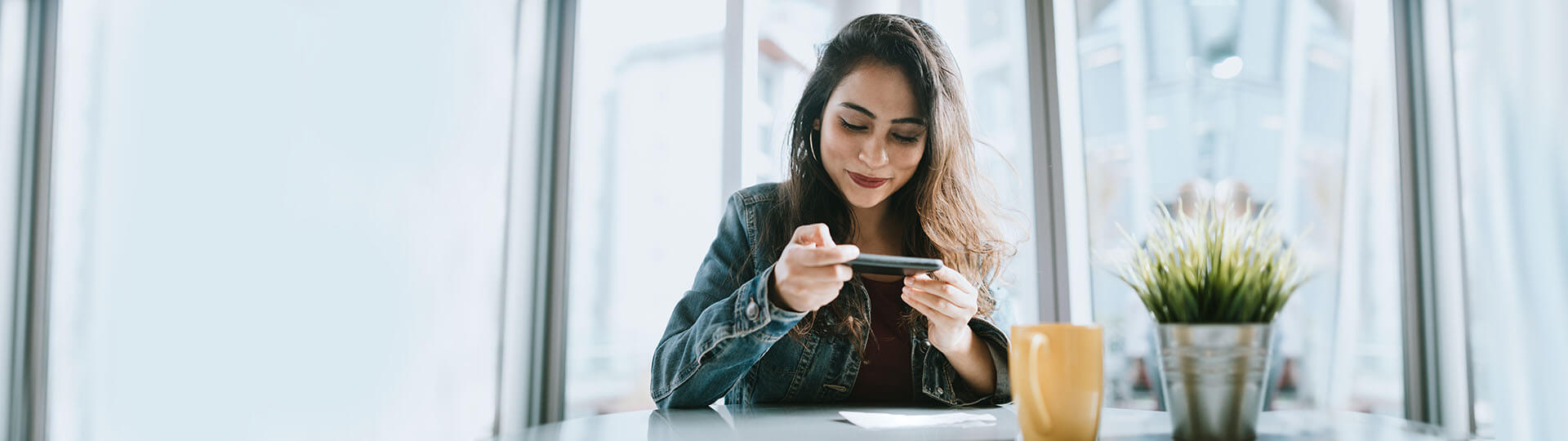 woman depositing check remotely