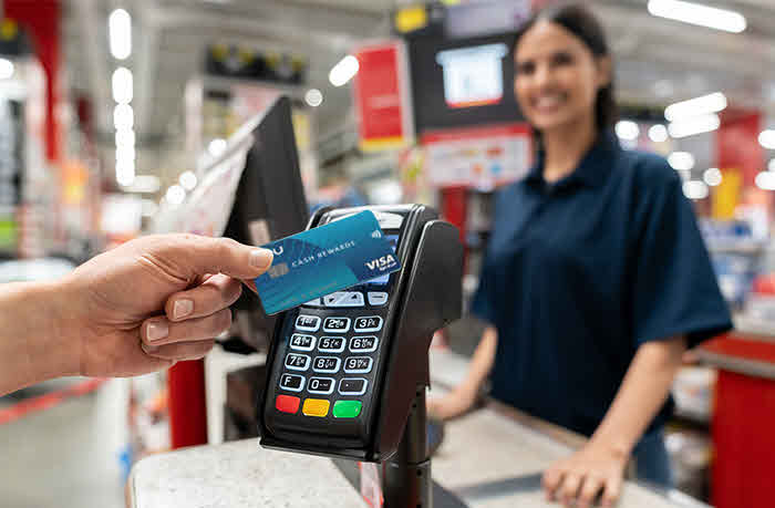 customer checking out with contactless reader